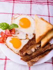 Breakfast with bacon and fried eggs