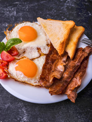 Breakfast with bacon and fried eggs