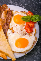Breakfast with bacon and fried eggs