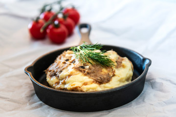 Dish made with cooked duck meat, dehydrated potato, fresh cream of mushroom and cheese