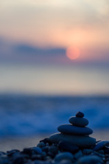stack of zen stones on pebble beach