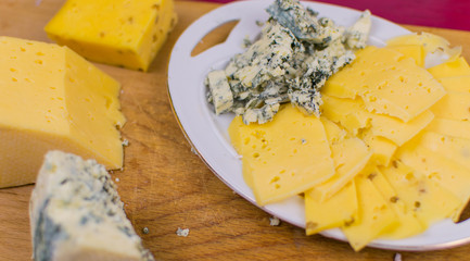 Different kinds of cheese chopped.