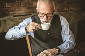Senior businessmen at cafe.