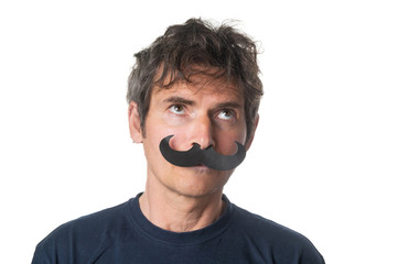Portrait of adult  man with paper camouflage mustaches on white background