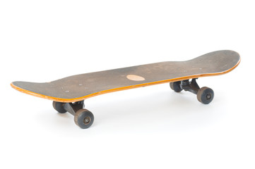 Used skateboard close up isolated on white background © unclepodger