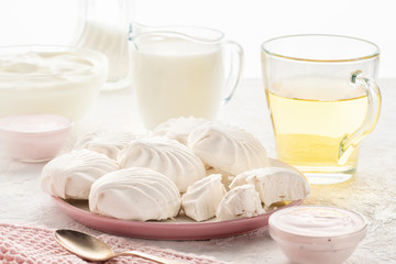 Protein products ingredients for breakfast marshmallows sour cream yogurt milk piece of bread green tea