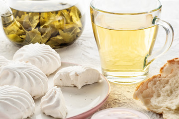 Protein products ingredients for breakfast marshmallows sour cream yogurt milk piece of bread green tea
