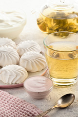 Protein products ingredients for breakfast marshmallows sour cream yogurt milk piece of bread green tea