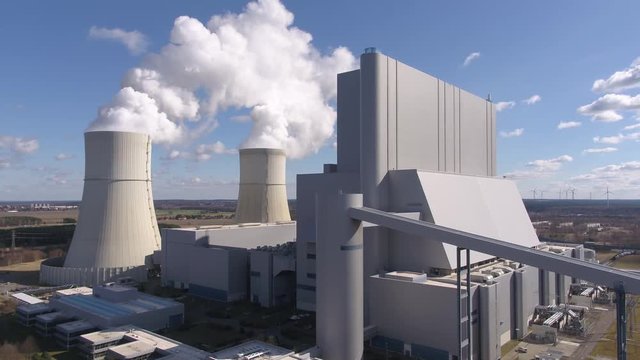 Aerial drone 4k - power station - kraftwerkanlage - background with green energy - wind power