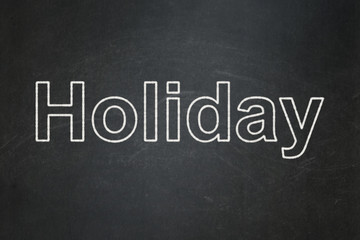 Tourism concept: text Holiday on Black chalkboard background