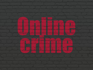 Obraz premium Protection concept: Painted red text Online Crime on Black Brick wall background