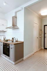 Scandinavian interior design. White grey studio apartment organization