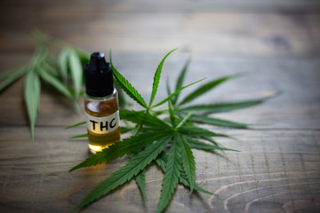 Medicinal cannabis with extract oil in a bottle