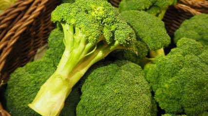 FRESH Broccoli  in basket at market.	