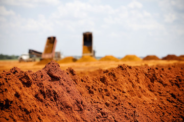 Pile of red dirt at construction site