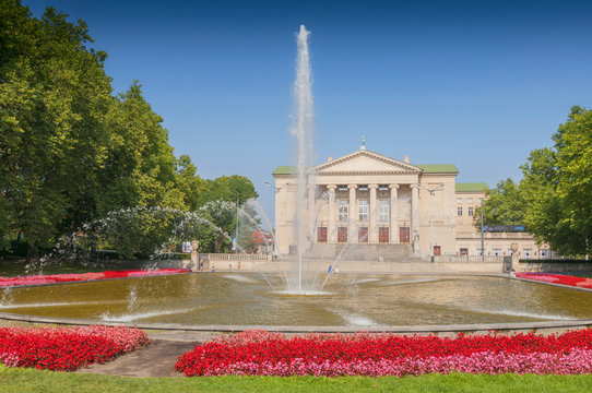 Poznan Stanislaw Moniuszko Great Theatre (Opera) building with fountain and garden, Poland.