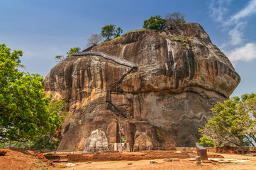 The second level stairs and entrance to the former fortress and monastery of Sigiriya rock, guarded by a pair of lion feet in Sri Lanka.