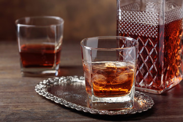 Glass of scotch whiskey and natural ice .