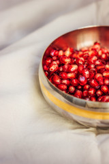 Pomegranate seeds in an iron plate