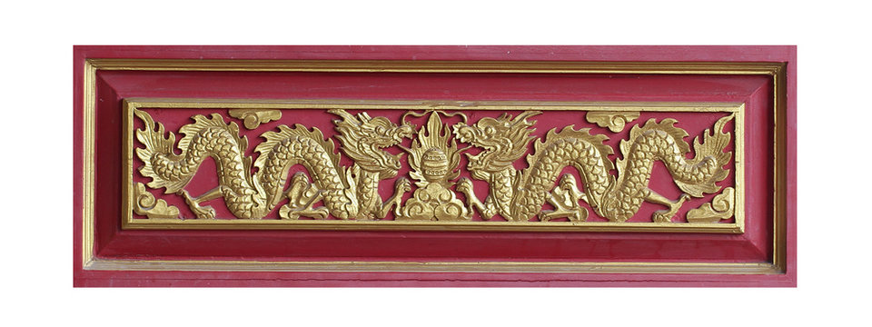 wooden carving sclupture of golden partner dragon among of flowers and painted on red wooden tray isolated on white backgrounds, sourvenir for home decoration, thai culture crafting,  graphic design