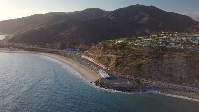 Aerial: Houses on a Cliff to the Ocean in Malibu
