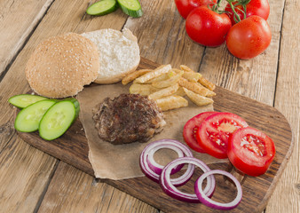 Delicious burgers with beef, tomato, cheese and lettuce