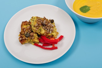 Azuki with vegetables on steam on a blue