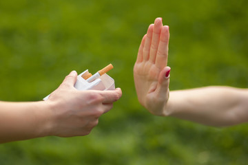 girl refuses to cigarettes. concept no Smoking