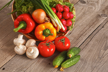 Pile of organic vegetables on a wooden table