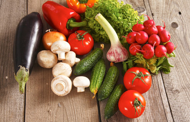 Pile of organic vegetables on a wooden table