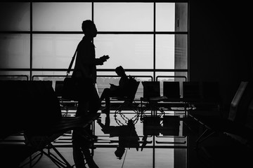 Silhouette tourists waiting for travel. subject is blurred.