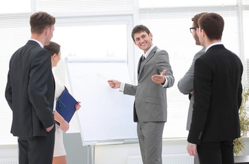 coach conducts business training for the business team