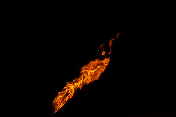 Fire, flame on a black background. Fire for advertising. An unusual game of bright red and yellow...