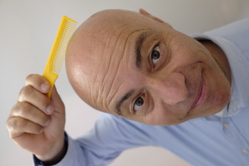 bald man with comb