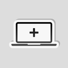 Obraz premium Laptop or notebook computer with medical cross on screen. Simple