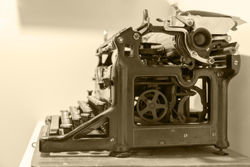 Old typewriter in antique photography vintage simulated. side view. toned filter