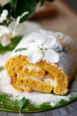Fototapeta na wymiar Cinnamon Apple Cake Roll with cream cheese