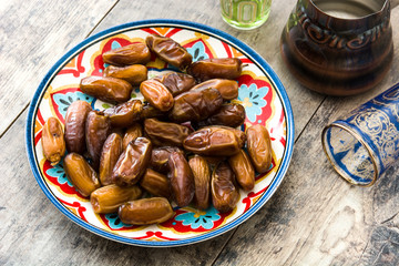 dates food in plate on wooden table