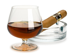 Cognac and cigar in a glass ashtray