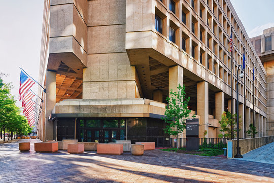 Edgar Hoover Building with flags in Washington, FBI headquarters