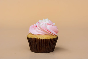 sweet cup cake dessert on yellow background and copy space