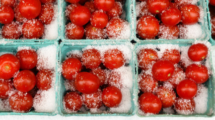 Grape tomatoes at the farmers market with snow