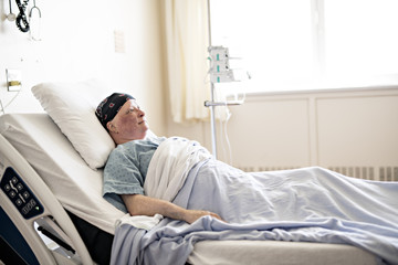 woman in hospital bed suffering from cancer