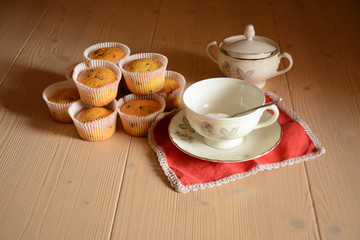 Breakfast set with some muffins/Typical italian breakfast set with cup of milk and cup of sugar and muffins