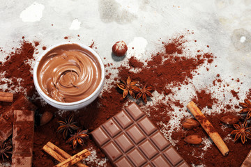 Chocolate bars on table with chocolate powder.