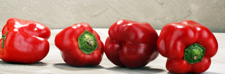 Fresh red bell pepper on grey background. raw vegetable
