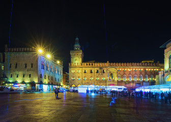 Fototapeta premium People at Palazzo d Accursio in Bologna evening