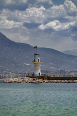 Fototapeta na wymiar Lighthouse against the turquoise sea