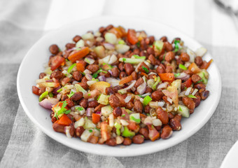 Homemade Spicy Vegetarian Gram Salad Also Know As Chana Salad or Chana Masala With Cutted Vegetables