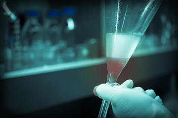 Scientist mix chemicals with The shake machine Before the experiment.Mixture laced with samples into test tubes,Thailand scientist working in the lab